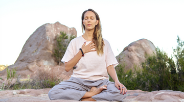 Woman breathing in outdoor space.