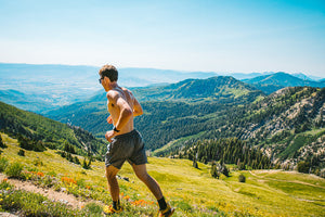 Man running in the mountains.