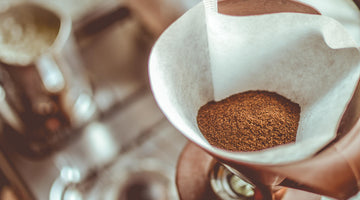 Fresh coffee grounds in a coffee filter.