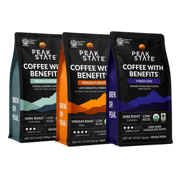 Three Peak State Coffee with Benefits whole bean bags shown side by side on a white background: Brain Support with teal, Immunity Boost with orange, and Stress Less with purple accents.