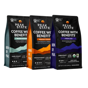Three Peak State Coffee with Benefits whole bean bags shown side by side on a white background: Brain Support with teal, Immunity Boost with orange, and Stress Less with purple accents.