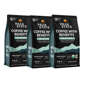 Three bags of Peak State Coffee with Benefit Brain Sustain dark roast whole bean coffee, arranged side by side on a white background.