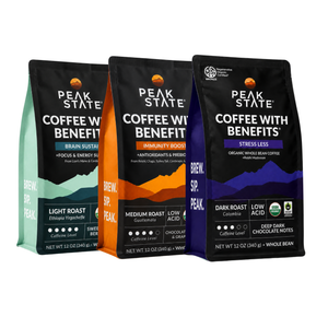 Three bags of Peak State Coffee with Benefits whole bean coffee in different flavors and roasts: Light Roast (Ethiopia Yirgacheffe), Medium Roast (Guatemal), and Dark Roast (Colombia). The bags are black with colorful accents (teal, orange, and purple) and are arranged against a plain white background.