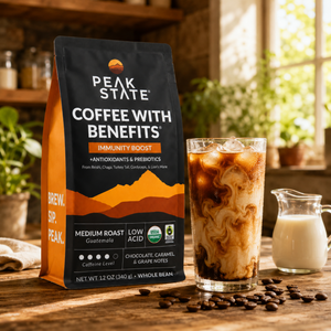 Peak State Immunity Boost coffee bag on outdoor table with brewed cup
